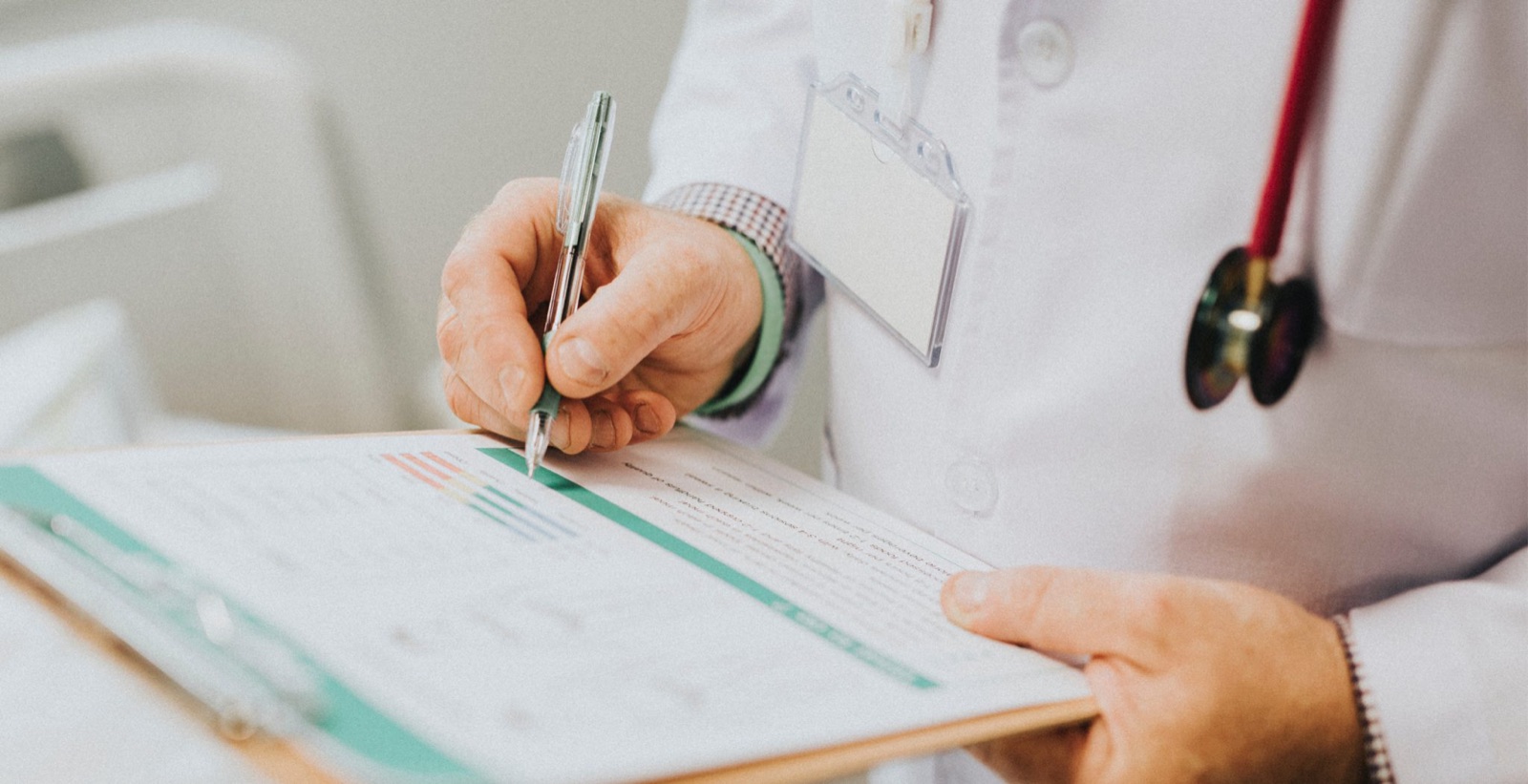 Doctor filling in a health check-up form